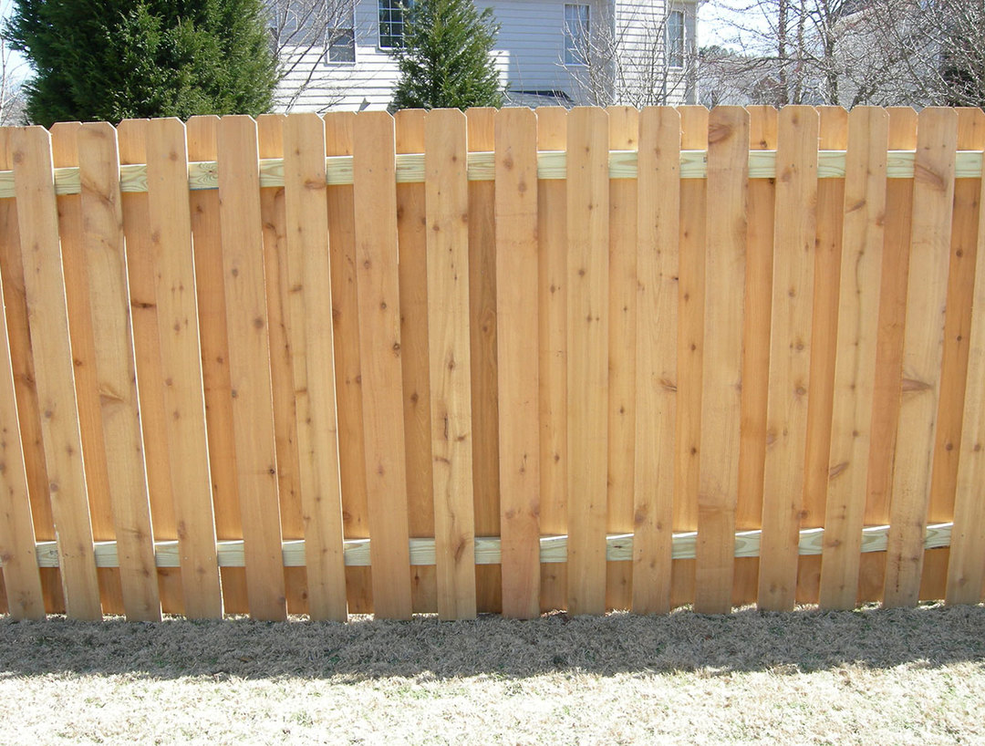 Wooden fence as a decoration for a private house: the choice of the type of fence, photos, examples