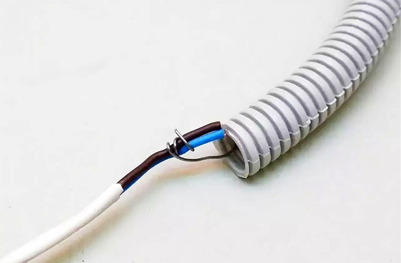 As a rule, the corrugated hose is equipped with a steel wire jig for pulling the cable